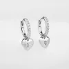 Heart Charm Silver Huggie Earrings sold by Wanderlust and Co