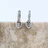 Heart Charm Silver Huggie Earrings sold by Wanderlust and Co