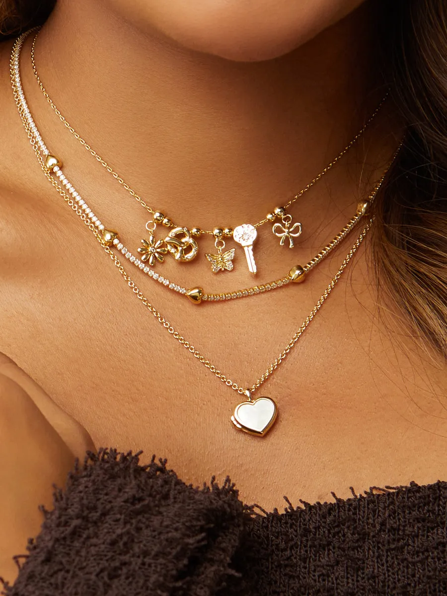 Bow Gold Drop Charm sold by Wanderlust and Co product image thumbnail 2