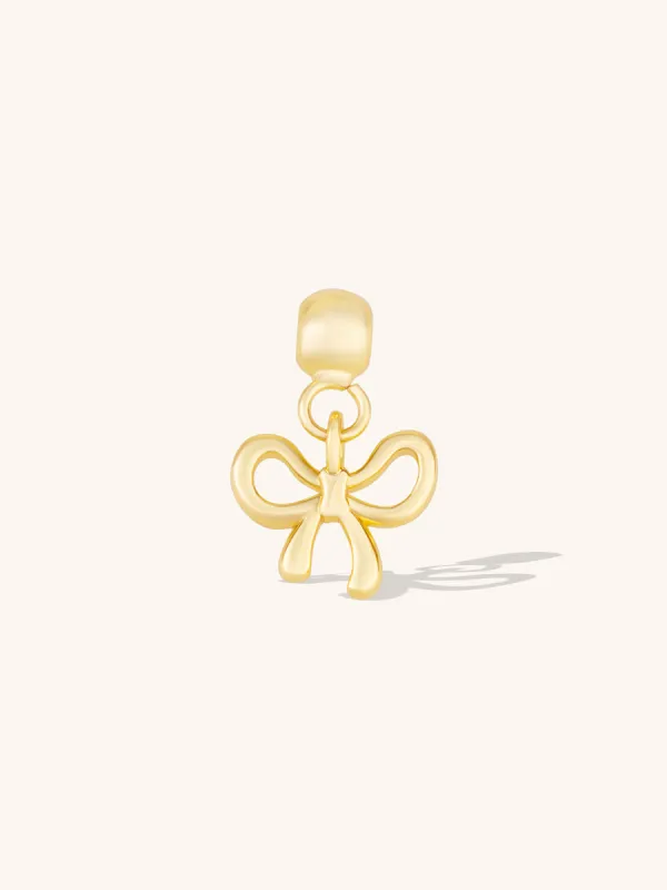 Bow Gold Drop Charm sold by Wanderlust and Co