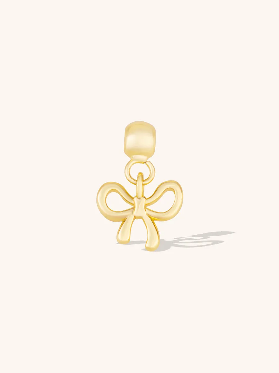 Bow Gold Drop Charm sold by Wanderlust and Co