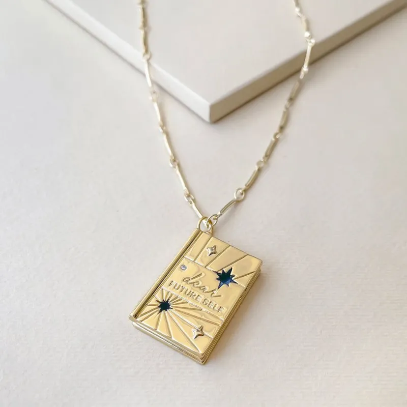 Dear Future Self Gold Locket Necklace sold by Wanderlust and Co