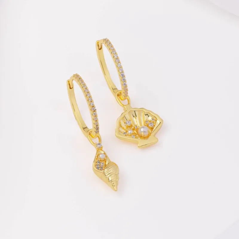 Sundaze Shell Gold Huggie Earrings sold by Wanderlust and Co