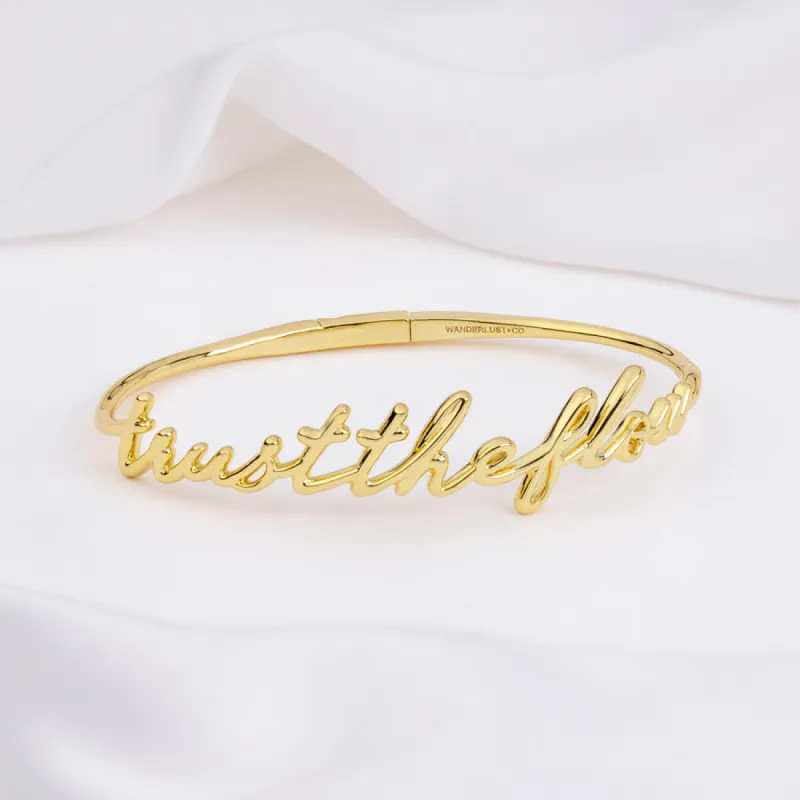 Trust The Flow Gold Bangle sold by Wanderlust and Co