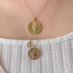 Out of this World Gold Necklace sold by Wanderlust and Co