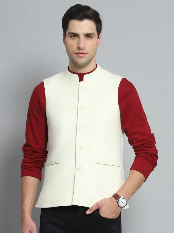 Men Cream Solid Band Collar Sleeveless Nehru Jacket made by Monte Carlo