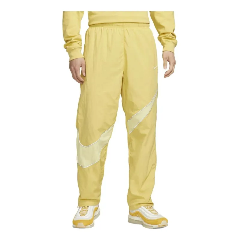 Nike Sportswear Swoosh Woven Pants 'Yellow' DX0595-700 sold by KicksCrew
