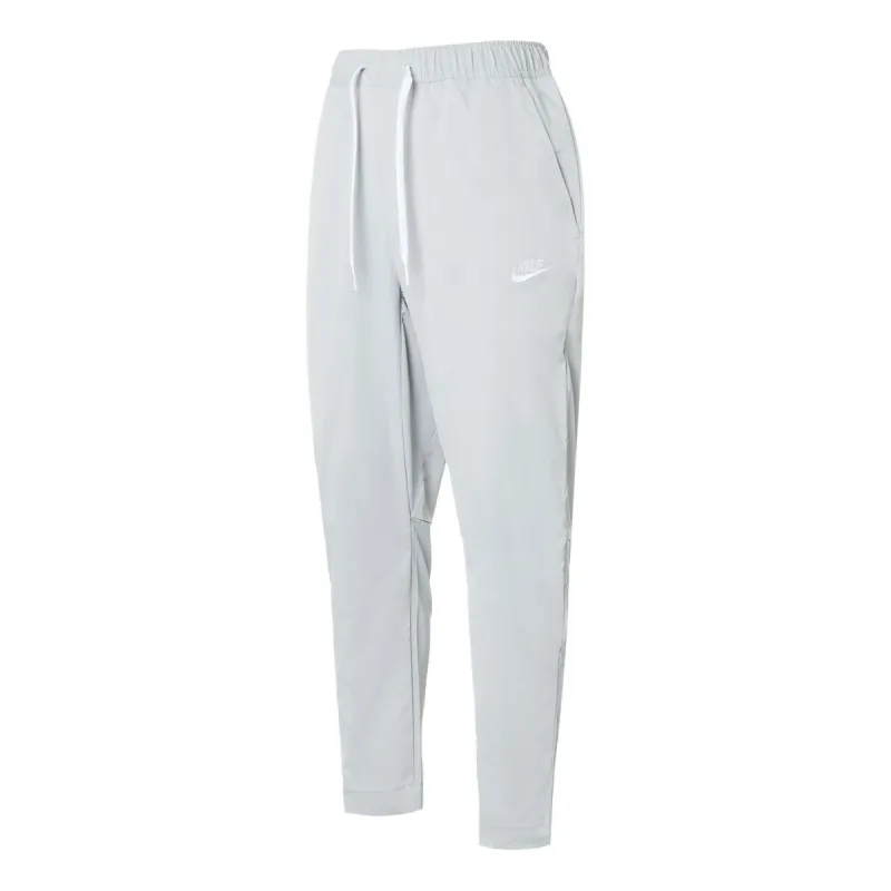 Nike Club Woven Tapered Leg Pants 'Light Smoke Gray White' DX0625-077 sold by KicksCrew