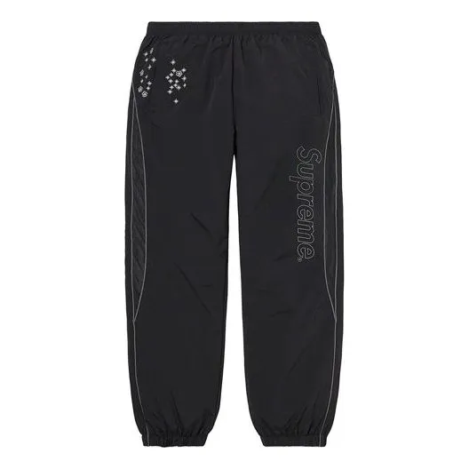 Supreme AOI Glow-In-the-Dark Track Pants 'Black White' SUP-SS22-120 sold by KicksCrew