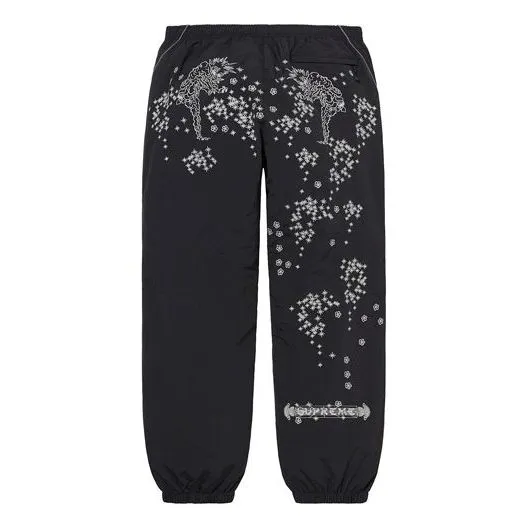 Supreme AOI Glow-In-the-Dark Track Pants 'Black White' SUP-SS22-120 sold by KicksCrew product image thumbnail 2