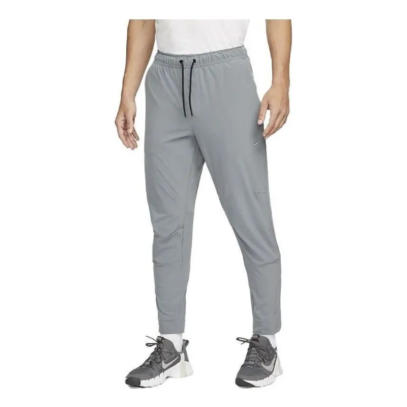 Nike Dri-FIT Zippered Cuff Versatile Pants 'Grey' FB7549-084 sold by KicksCrew