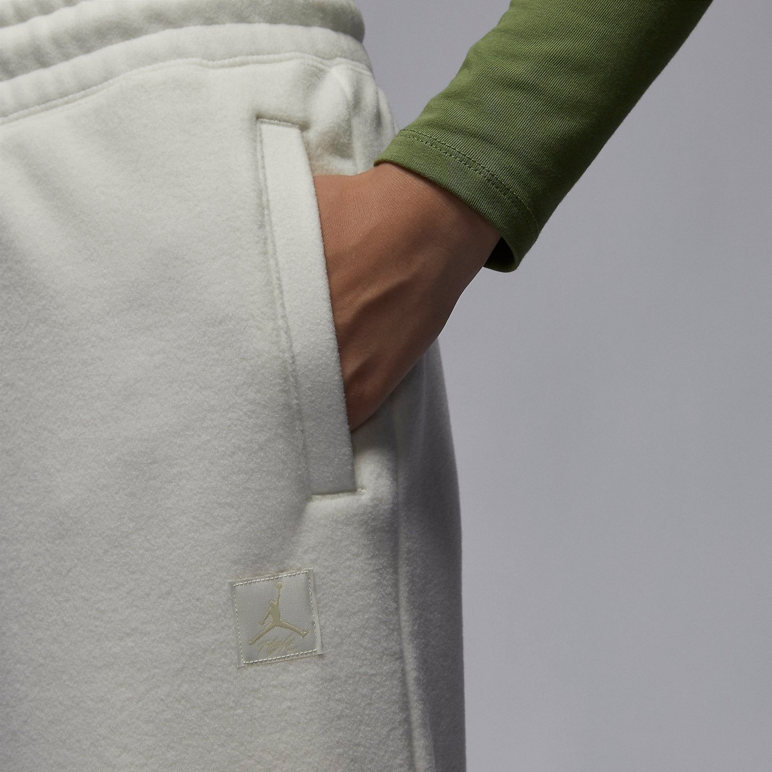(WMNS) Air Jordan Flight Fleece Winterized Pants 'Off White' FD7235-133 sold by KicksCrew product image thumbnail 3