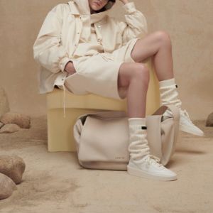 Fear of God Essentials FW22 Nylon Coaches Jacket 'Canary' FOG-FW22-935 sold by KicksCrew