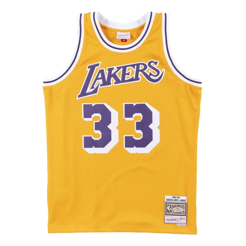 Mitchell & Ness x NBA Los Angeles Lakers 1984-85 Swingman Jersey 'Kareem Abdul-Jabbar 33' SMJYAC18110-LALLTGD84KAB sold by KicksCrew
