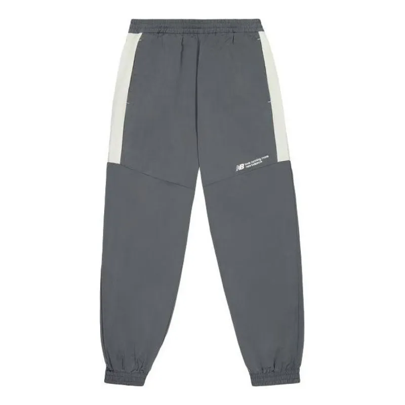 New Balance Woven Track Pants 'Dark Grey' NTE24031-DKG sold by KicksCrew