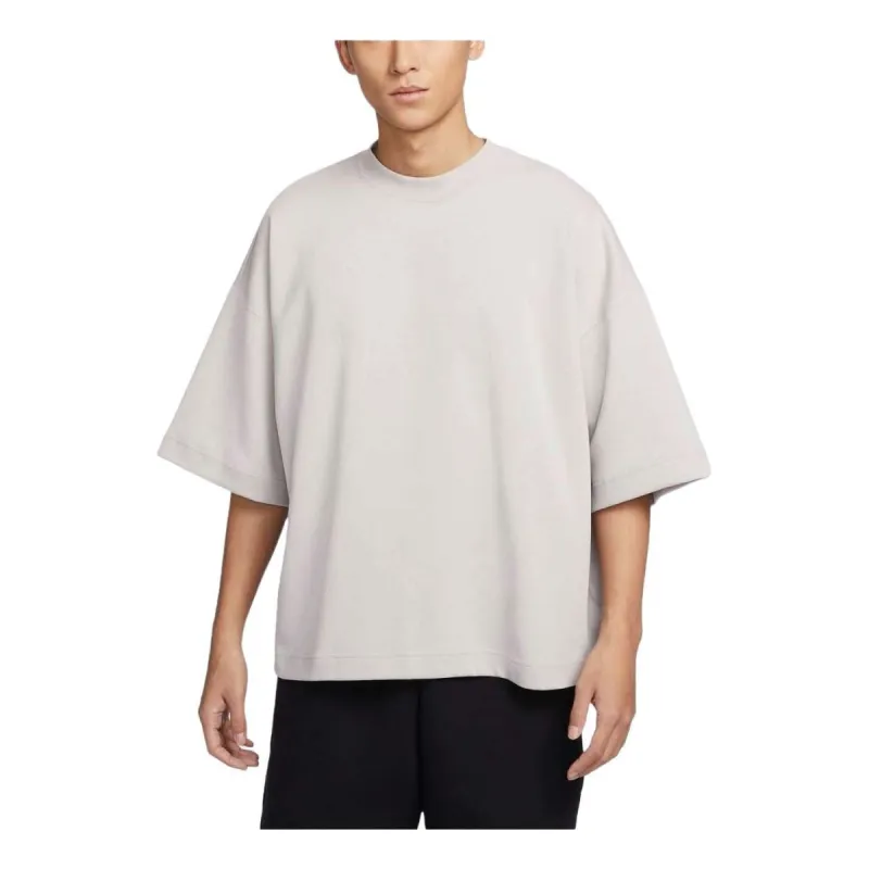 Nike Sportswear Tech Fleece Reimagined Oversized T-shirt Asia Sizing 'Light Iron Ore' FB8166-012 sold by KicksCrew