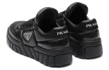 (WMNS) PRADA Padded Nappa Leather Sneakers 'Black' 1E136N_2DL8_F0002_F_B030 sold by KicksCrew