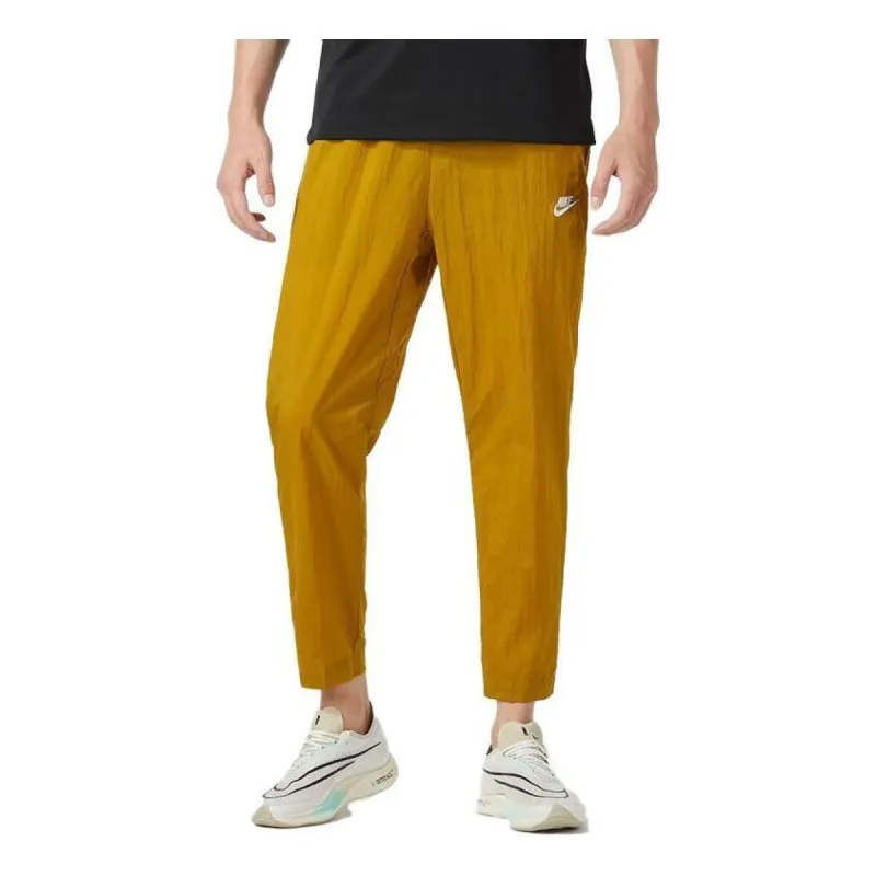 Nike Club Lightweight Woven Trousers 'Bronzine' FB7407-716 sold by KicksCrew