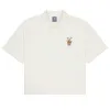 (WMNS) New Balance Floral Print Polo 'Ivory' NFE26112-IV sold by KicksCrew