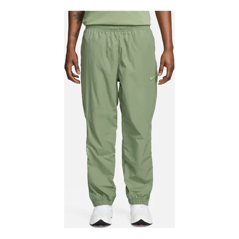 Nike x Nocta Woven Track Pants 'Oil Green' FN7669-386 sold by KicksCrew