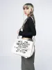 Non Stop White Canvas Messenger Bag sold by Minga London