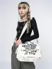 Non Stop White Canvas Messenger Bag sold by Minga London