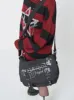 Troublemaker Black Canvas Messenger Bag sold by Minga London