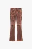 "INKSTRIKE” TAN BLACK STACKED FLARE JEAN sold by valabasas