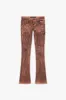 "INKSTRIKE” TAN BLACK STACKED FLARE JEAN sold by valabasas