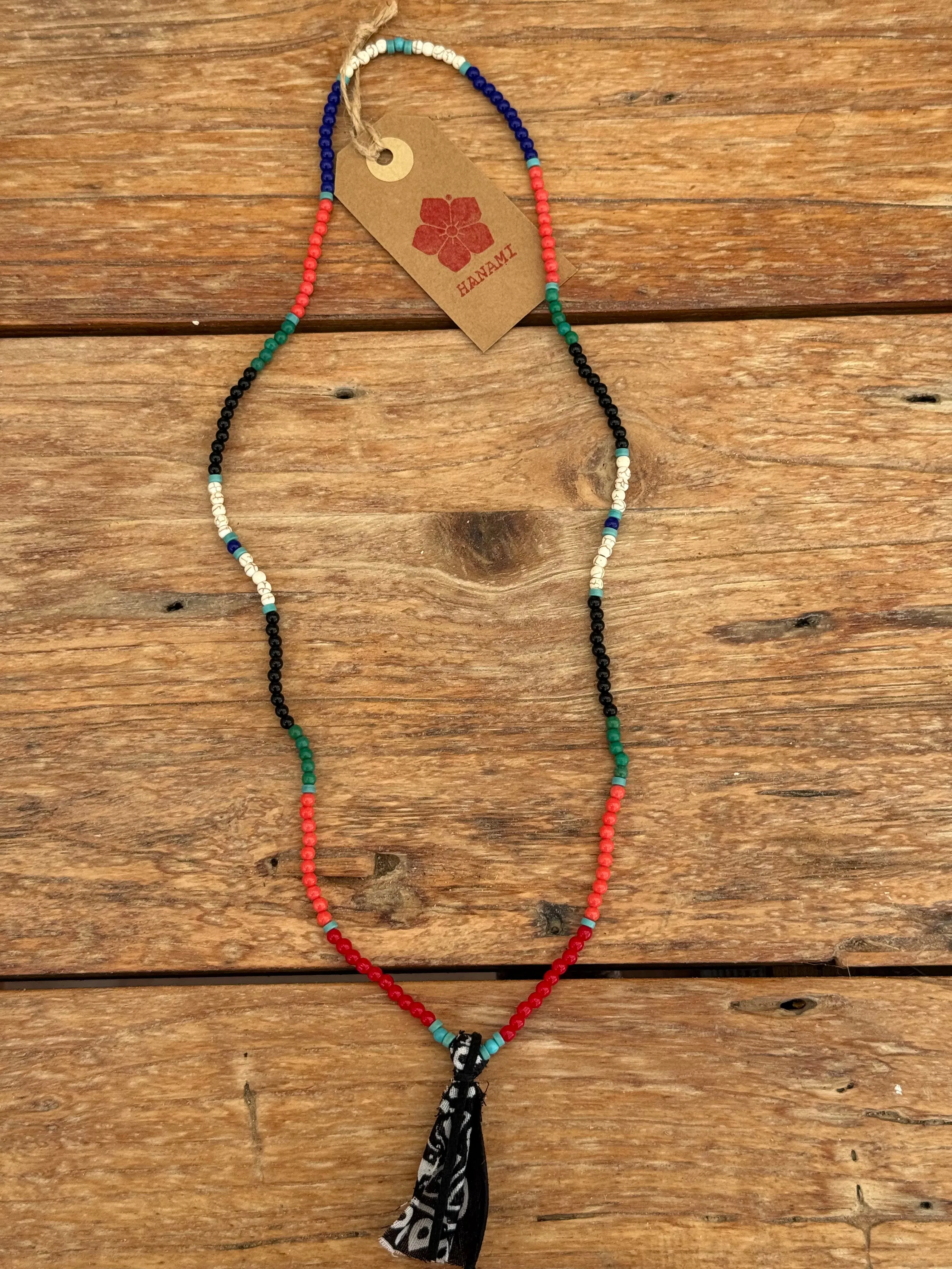 beads necklace orange black sold by Dr. Collectors