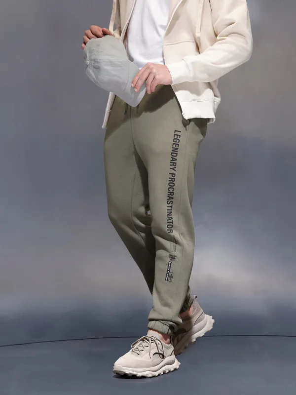 Men's casual slim fit jogger with typographic print design | Olive sold by Wrogn