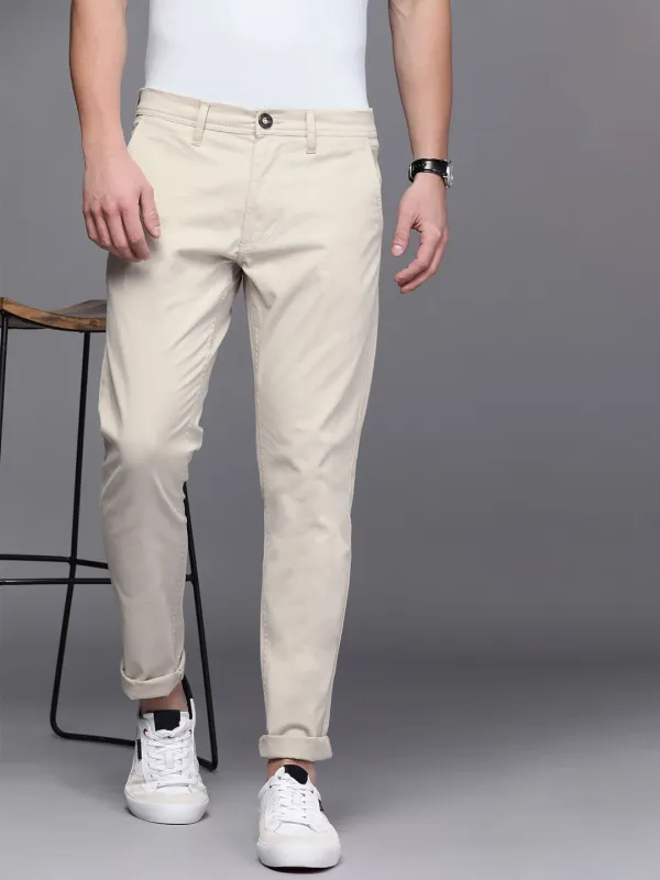 Solid Beige Tapered Fit Trousers sold by Wrogn