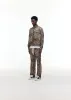 LEOPARD PIPED TRACK PANTS sold by Cole Buxton