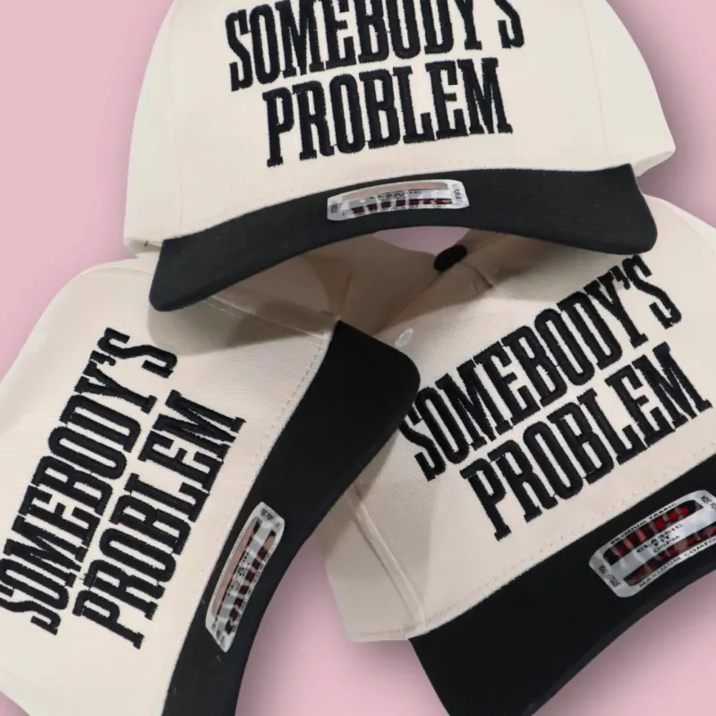 Somebody's Problem Trucker Hat sold by Hemline