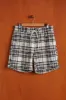GARDEN PLAID BOUCLÉ SHORTS - BLACK sold by Portuguese Flannel