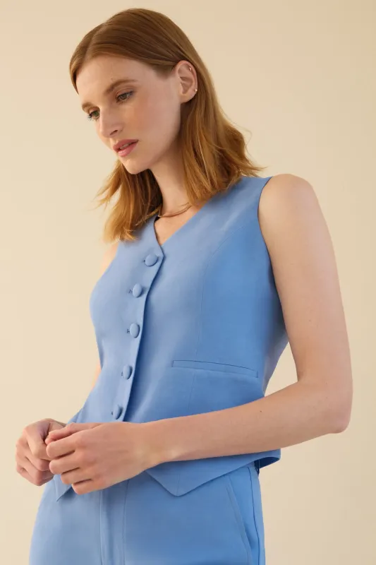 The No Gape Zora Linen Vest Neon Blue sold by Sophie Rue