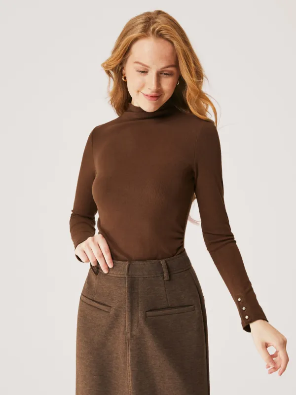 Pearl-Buttoned Cuff Mockneck Top sold by ogl move