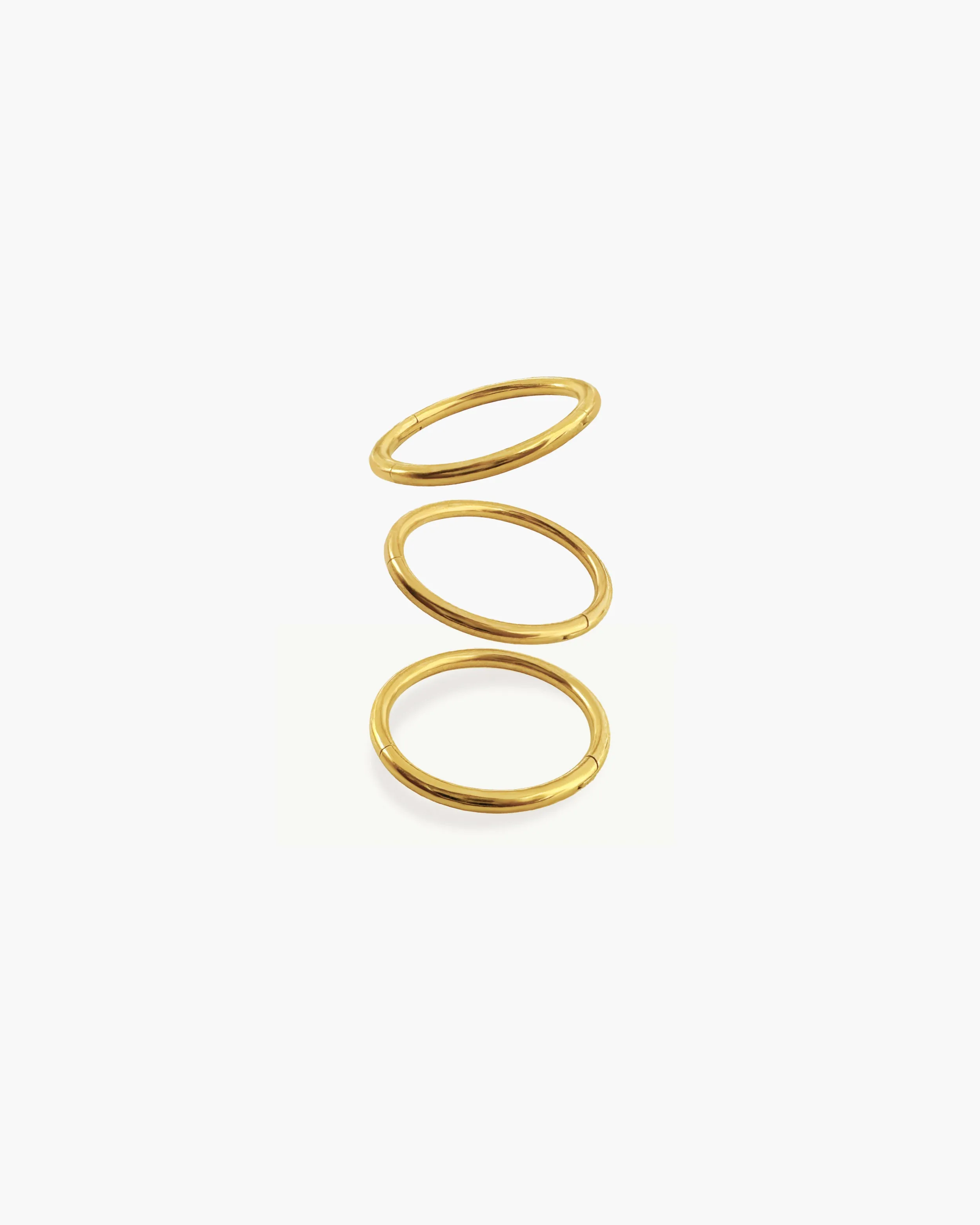 Single Mini Hoop Helix Earring in Gold sold by En Route Jewelry product image thumbnail 4