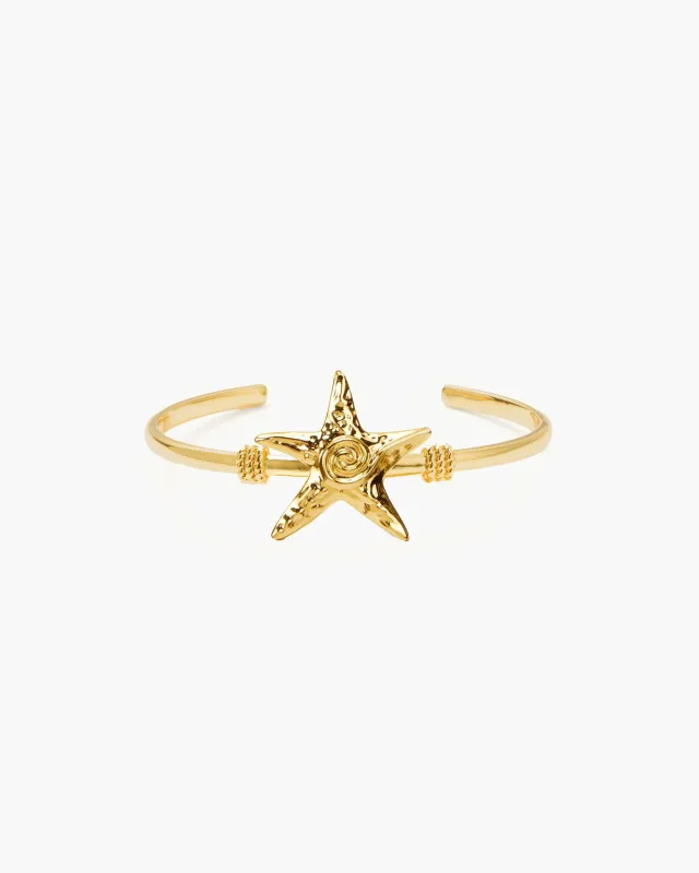 Gold Starfish Bangle sold by en route