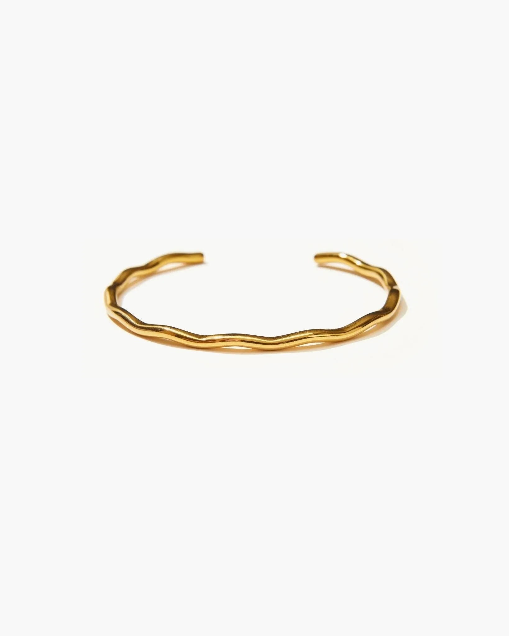 Golden Wave Bangle sold by En Route Jewelry