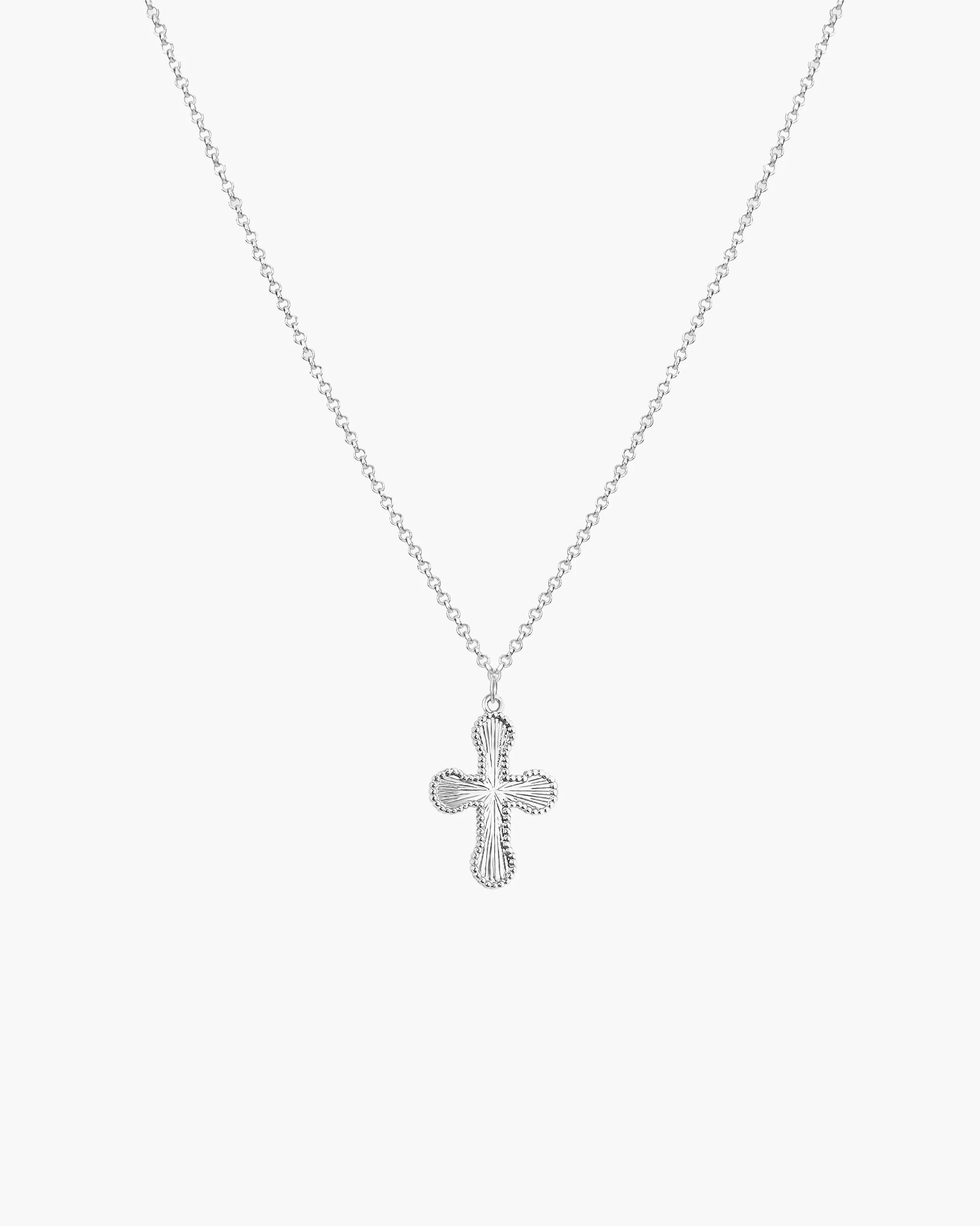Mini Cross Pendant Necklace in Silver sold by en route