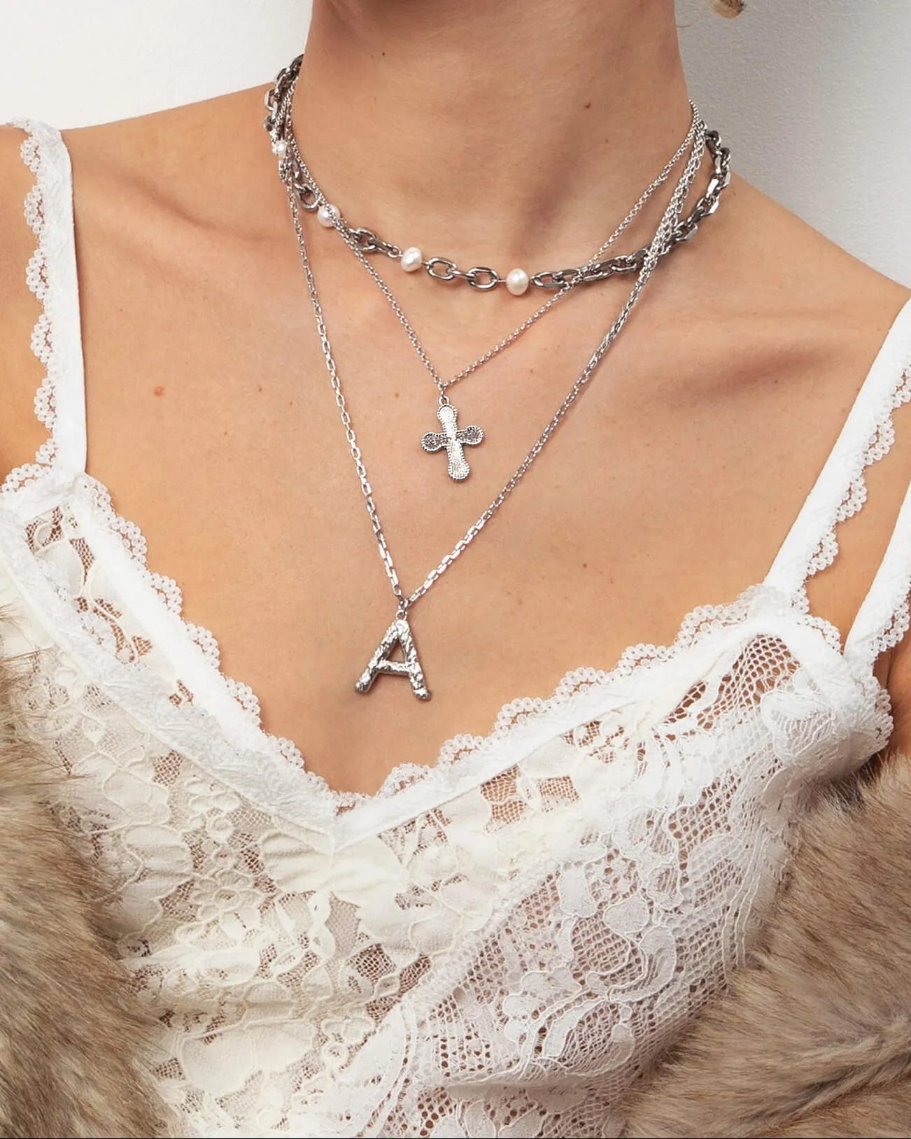 Mini Cross Pendant Necklace in Silver sold by en route product image thumbnail 2