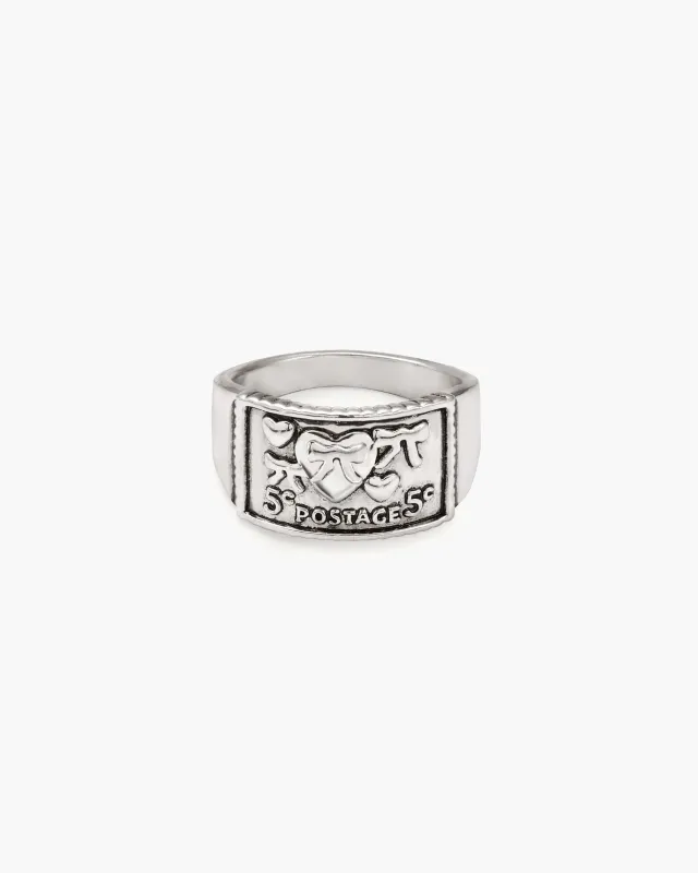 Lovers Sign Postage Ring sold by En Route Jewelry