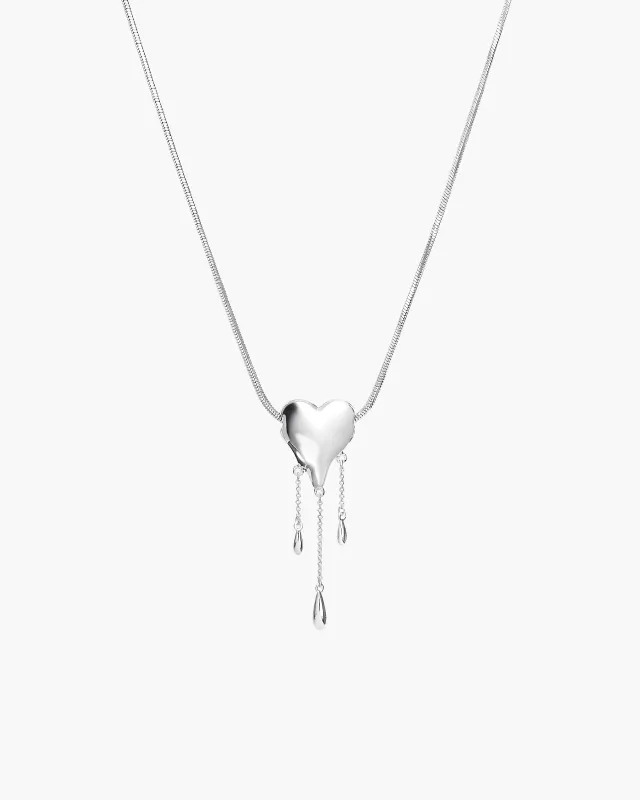 Venom’s Golden Drip Heart Necklace in Silver made by En Route Jewelry