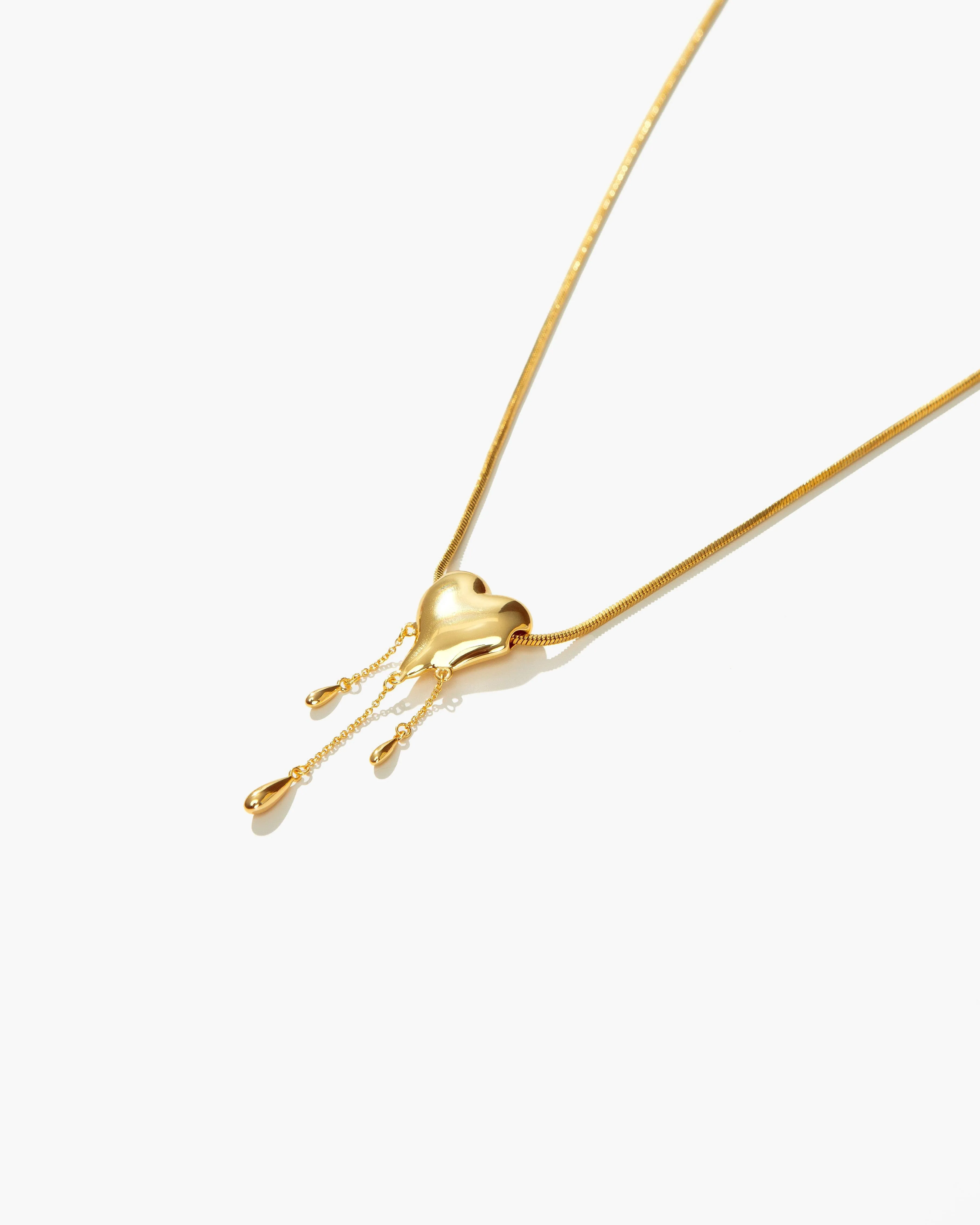Venom’s Golden Drip Heart Necklace sold by En Route Jewelry product image thumbnail 3