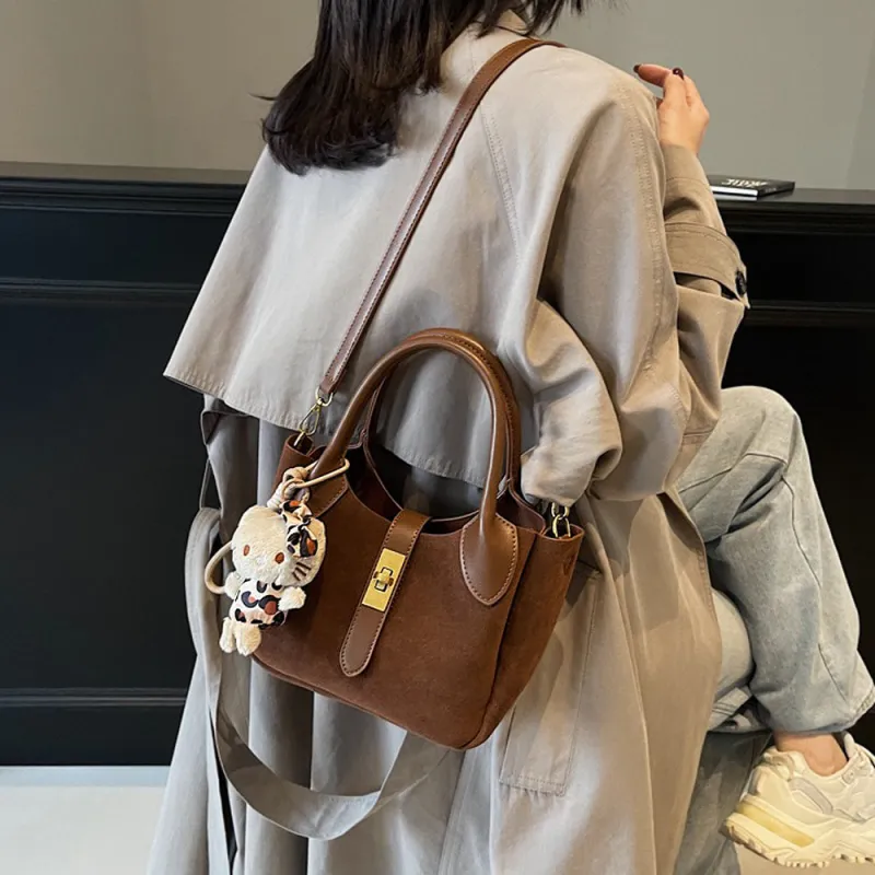 Nicole Crossbody Shoulder Tote Bag With Gold Buckle and Bag Charm in Tan Faux Suede made by XYlondon