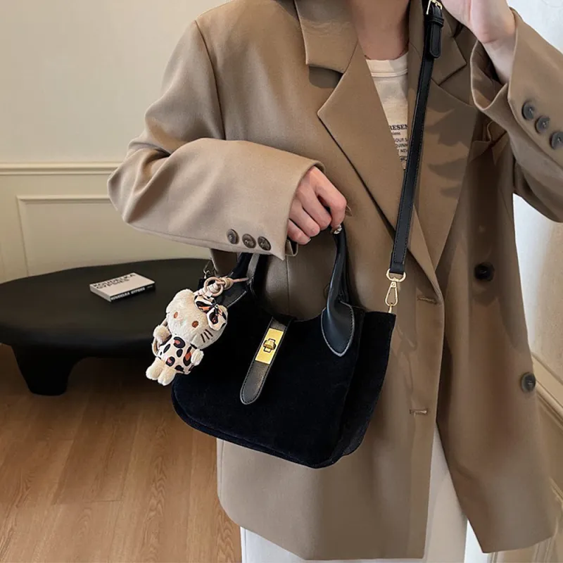 Nicole Crossbody Shoulder Tote Bag With Gold Buckle and Bag Charm in Black Faux Suede sold by XYlondon