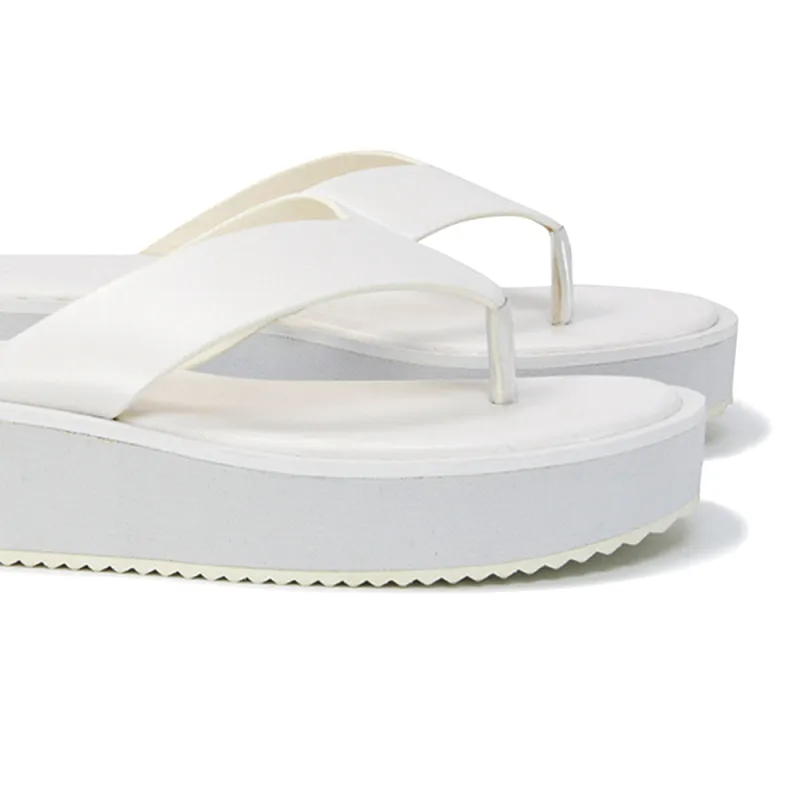 Tammi Thong Strap Flatform Flip Flop Sandal Slides in White Synthetic Leather sold by XYlondon
