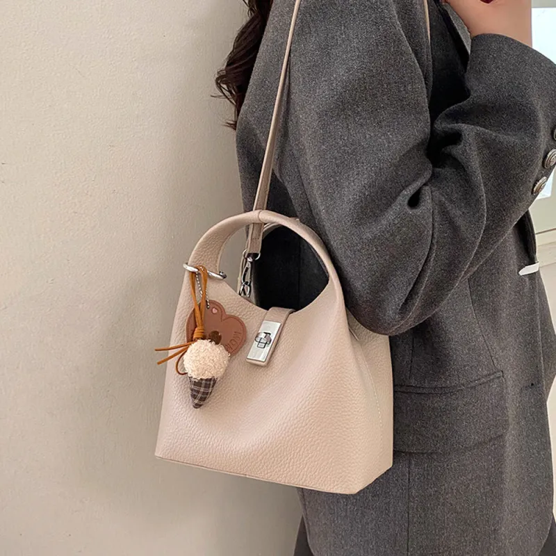 Storm Small Crossbody Bag With Detachable Bag Charm in Taupe made by XYlondon