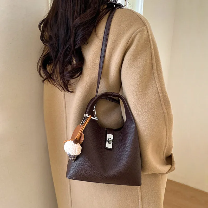 Storm Small Crossbody Bag With Detachable Bag Charm in Brown made by XYlondon
